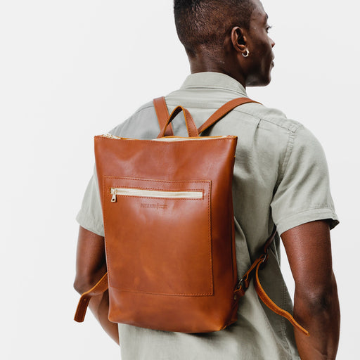 All Color: Honey | Model wearing rectangular slim leather backpack